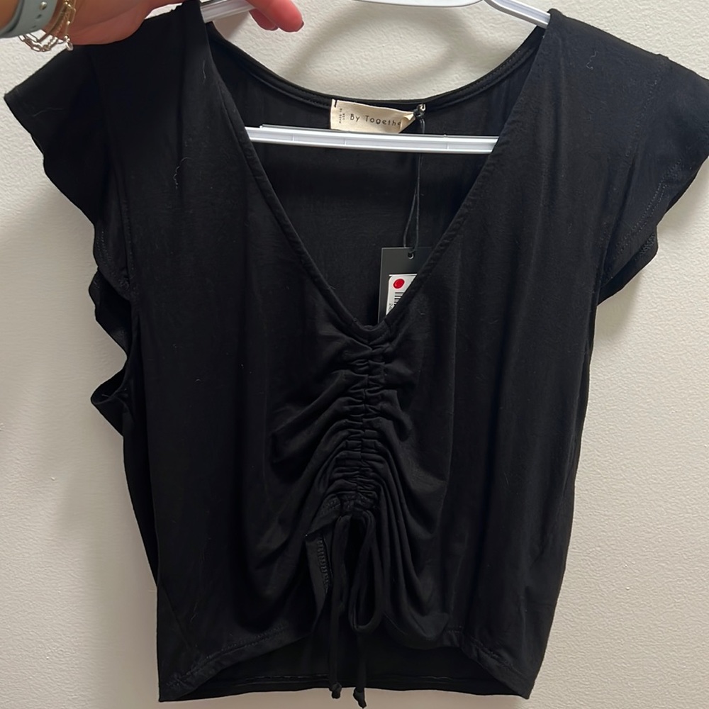 BRAND NEW WITH TAGS! Black crop top with cute cinch detail.